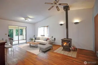 Living room features a cozy wood burning fireplace