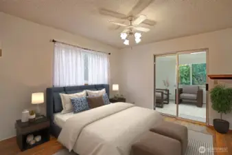 Light & bright primary bedroom has a full wall length closet & slider doors to sunroom!