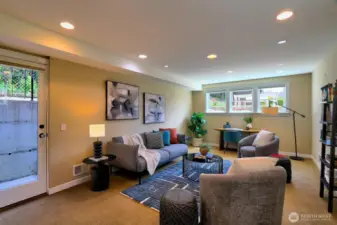 The spacious family room on the lower level opens to a patio and the rear yard.