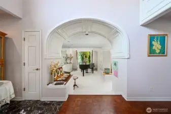 From the foyer, through the piano room, down into the living room, and back up through the dining room, this home sets the stage for truly gracious and formal entertaining.
