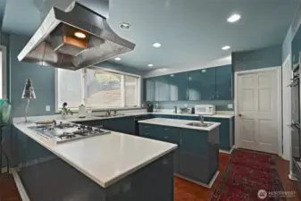 With miles of countertops and a spacious cooking island, preparing large meals here is a dream.