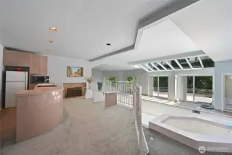 The home essentially has its own private health club. There is a long indoor pool, a large hot tub, a sauna, a full second kitchen and plenty of room for weights, a Peloton as well as most any other athletic equipment you might wish for.