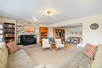 Rec room downstairs with wood burning insert.