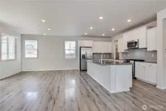 Beautiful kitchen and dining area. Slider off dining area leads to the covered patio.