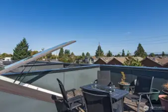 Rooptop deck with cozy firepit and territorial views.