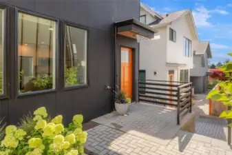 Front patio and off street EV ready parking.