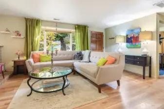 Spacious living room features West facing bay window for lots of natural light.