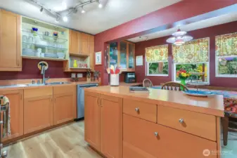 The remodeled kitchen has lots of great features! Bold artistic colors, modern fixtures and many custom built-ins.