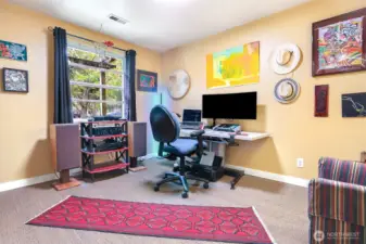 Bedroom #2 is currently being used as a home office. It has a peaceful outlook of the front yard. New carpet was  installed in 2024.