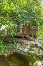 The detached studio overlooks the peaceful Koi pond and waterfall.