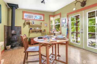 This unique artist studio could also be used as a private home office.  Cozy woodburning stove, cork floors and Fir wrapped windows really make this a special place.