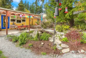 This area has lots of color in the Summer and the yard attracts many different species of birds.