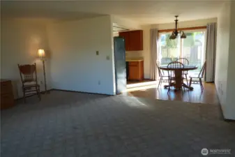 Looking from the living room into the dining and through to the outside.