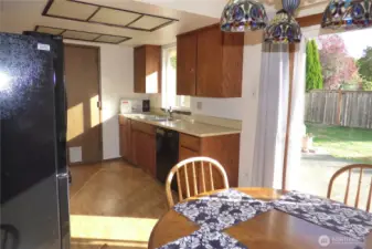 Looking into the kitchen. Door leads to double garage.