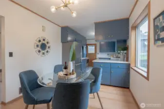 Dining area has original fir floors that have been completely refinished, large window to backyard