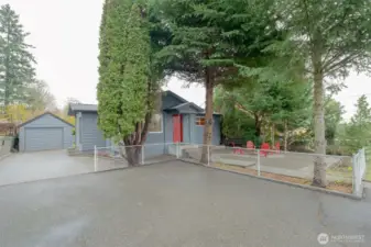 Large, deep driveway with one car garage that has more storage in open attic. There is parking for everyone here!