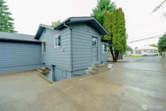 Side door that leads in to the kitchen; back downstairs door that provides separate entry to basement!