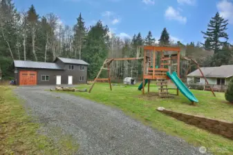 Almost new Spane built metal building!  This structure offers a garage/shop space, separate office, plus an almost finished Detached Auxillary Dwelling Unit!