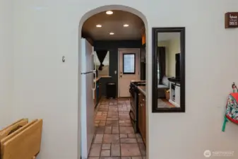 The arch doorway leading to the kitchen.