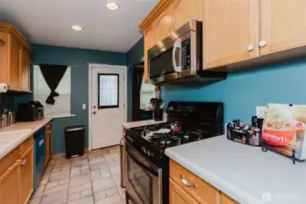 Nice kitchen with tile floors and gas cook top for the chef.
