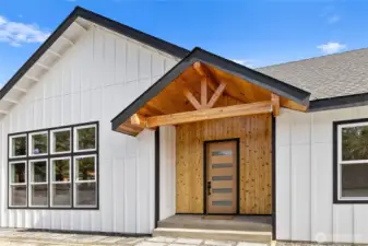 The front exterior features a modern, streamlined blend of materials that creates a polished, contemporary presence