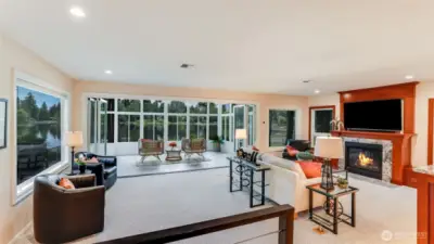 Your guests may never leave while enjoying the extra large family room with a warm inviting gas log fireplace. While enjoying the warmth of the fireplace the lake views are ever present morning noon and evening.