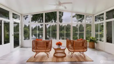 A large additional room (the lake room) with full views of the lake has heated tile floors, ceiling fan, and second door to the backyard.