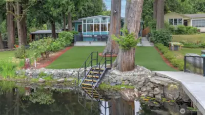 35 ft of low bank waterfront with dock, swim steps and two ladders.