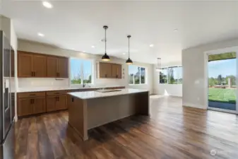 Kitchen boasts Stainless Steel appliances, quartz countertops and custom soft close cabinets