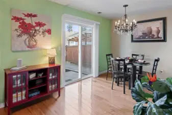 Dining area with slider to back deck, storage shed/room and back yard.