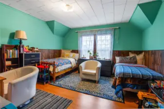 Large bedroom in Main Unit 704 with twin beds as currently decorated;Wood floors; Upstairs bedroom