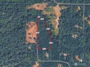 Overhead view with approximate boundaries in red and dimensions from county records.