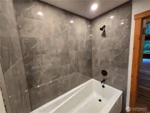 Beautiful custom tile work in extra large tub