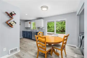 Cute dining room with slider to back porch