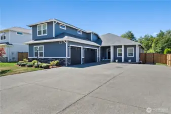 Charming front porch and spacious driveway welcome you home.