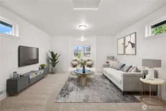 Expansive bonus room above the garage with plush carpeting, multiple windows for natural light, and endless possibilities for use including: additional loft bedroom, extra office space, game room, or media room. Virtually staged.