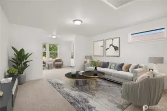 Massive upstairs bonus room with plush carpeting, versatile open layout, and abundant natural light from multiple windows. Virtually staged.