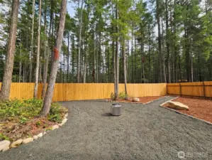 Firepit area, gate to back trail & play field