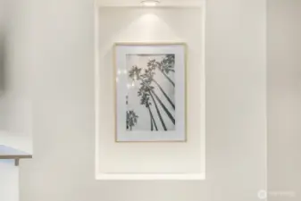 Thoughtful architectural details,  with lighted hallway with two display niches for showcasing art or favorite decor items.