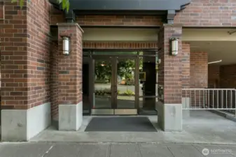 Front entrance of The Metropole, secure lobby. Garage parking with EV charger.