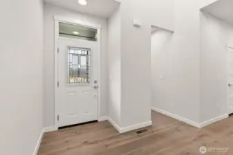 Lots of natural light and soaring ceilings great you in the entryway.