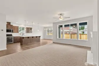 Open entertaining area between the living room and kitchen features large, oversized windows for perfect, natural light.