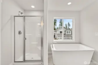 Walk-in shower and a free-standing tub in the primary bath!