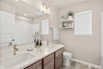 Virtually staged upstairs hall bath for illustration only.