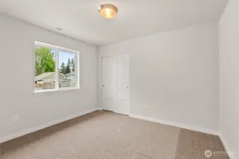 Third bedroom features plush carpet and great natural light
