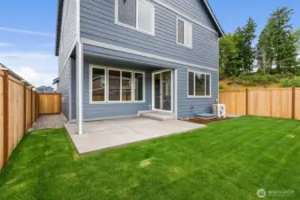 View of back, showcasing a partially covered patio and exposed patio, perfect for four seasons of use