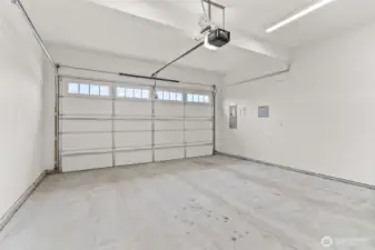 Two-car garage is primed for a more finished look and does come with garage door opener.