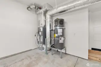 Furnace and hybrid water heater located in garage