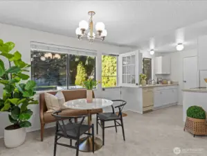 Cozy dining nook is adjacent to the kitchen and backyard access