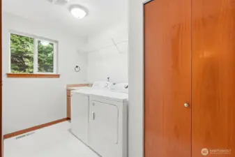 MAIN LEVEL LAUNDRY ROOM WITH WASHER DRYER